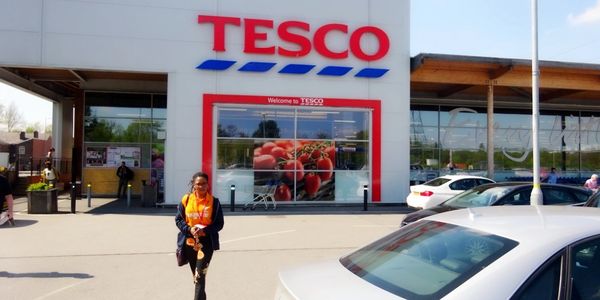 A Volunteer from The Widows Empowerment Trust shopping for a widow in need.