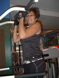 Tracey, performing chin-ups on the Weight Assisted Chin-up / Dip