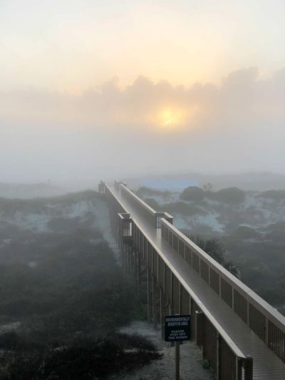 Amelia Island FL. Boardwalk to the beach at Sunrise. Foggy morning