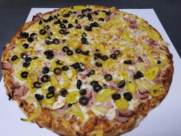 Ham, pineapple, yellow peppers, black olives on 3/4