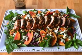 Nectarine Pork Tenderloin Salad with balsamic dressing and served on a serving platter family style.