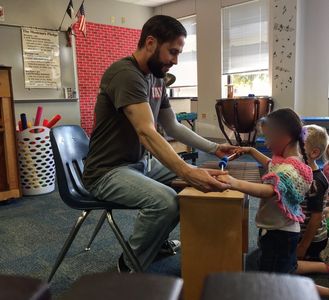 Mr. G
teaching a student on a xylophone