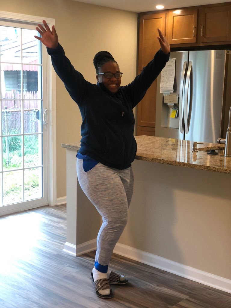First time homebuyer celebrates the closing on her newly renovated home in Enright Court!