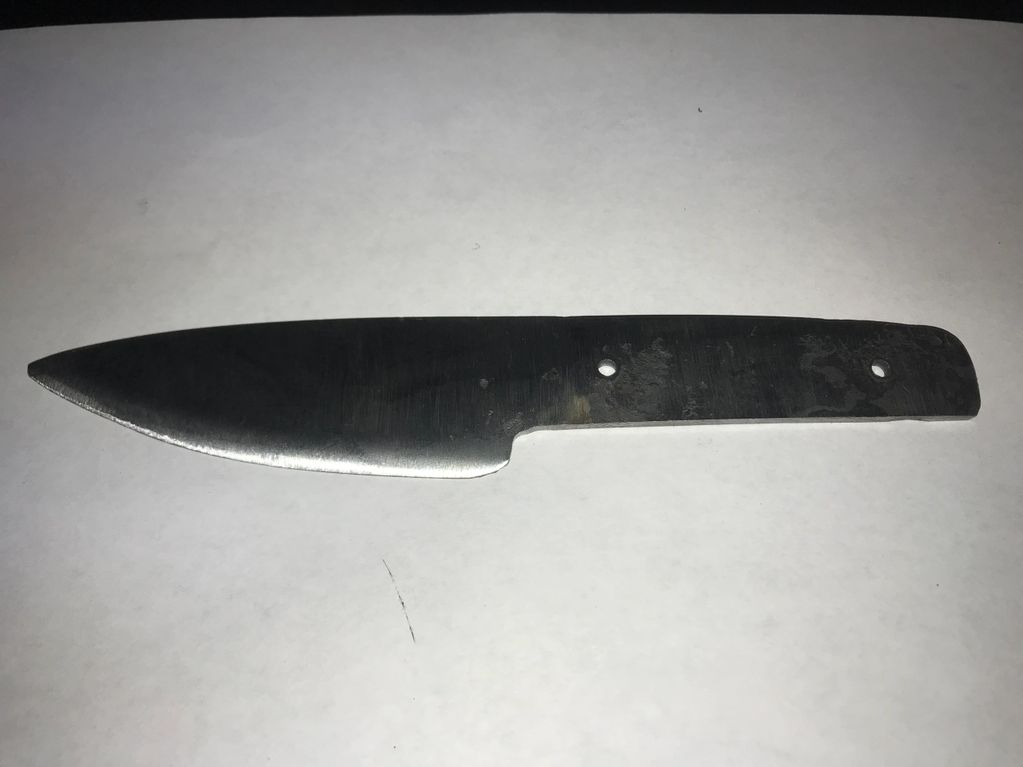 Small utility/hunter in 1095 high carbon steel.  Just heat treated, and ready for handle scales, and