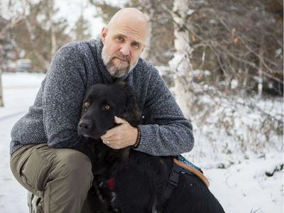 Retired Canadian Forces Captain Paul DeGroot and Service Dog Raven