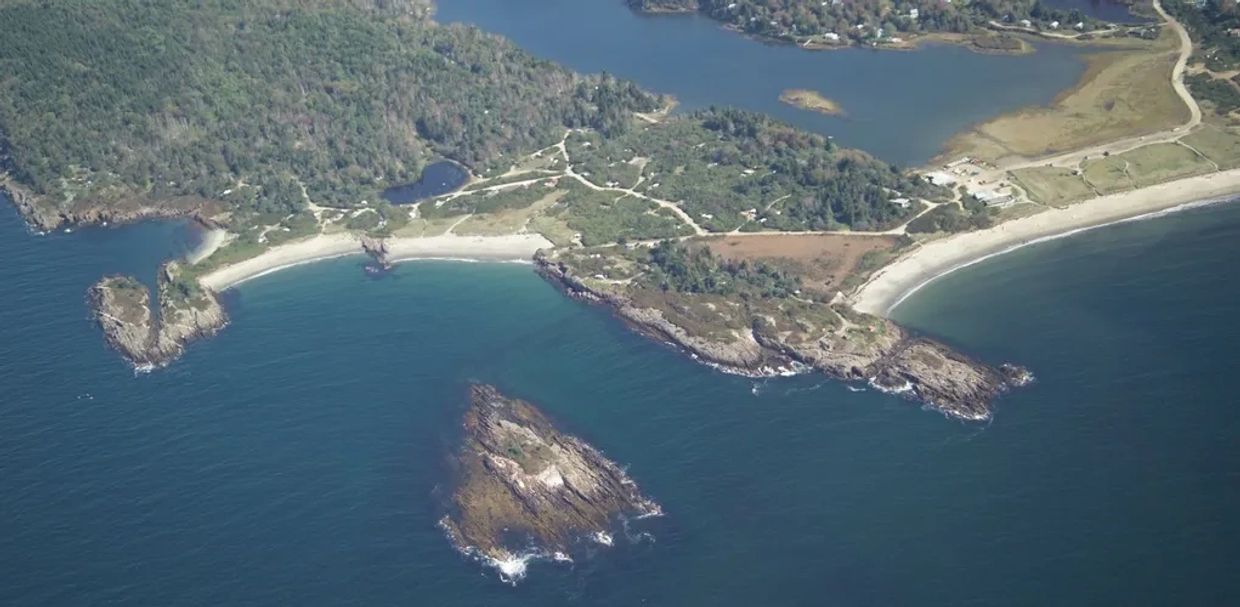 Aerial view of Hermit Island Campground, Phippsburg, Maine with beach, islands, ocean.