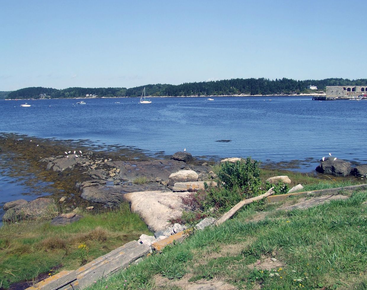 View of Kennebec River, Phippsburg, Maine from 1607 Popham Colony Site showing river, lawn, Fort Pop