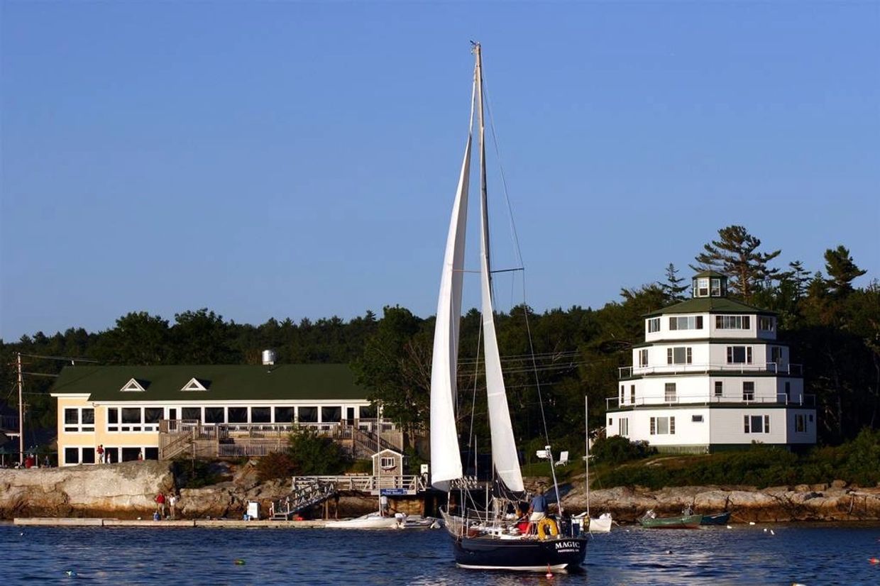 Restaurant, Lighthouse, sailboat in the cove at Sebasco Harbor Resort, Phippsburg, Maine