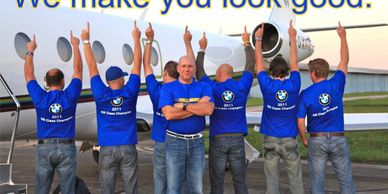 A group of men wearing shirts with BMW logos