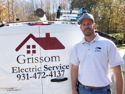Brandon of Grissom Electric Service LLC standing next to a company truck in Clarksville, TN