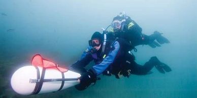 Scuba diving using an underwater propulsion vehicle