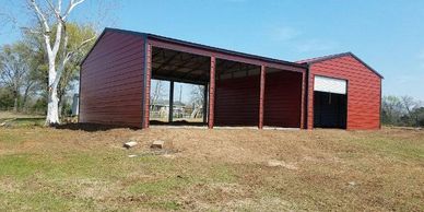 Red Texwin metal garage and storage combo building.