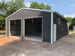 30x40x12 Texwin metal garage with 10x10 roll up doors.