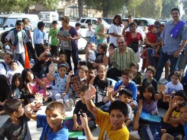 A crowd of kids and adults