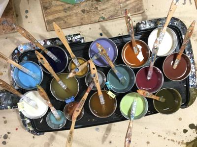 Pots of pigmented encaustic paint.