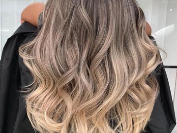 women with a ash balayage ombre done in a salon in west palm beach