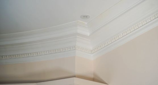 marble pillar with intricate crown design supporting an arch