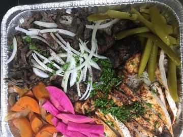 tray of Kobob, chicken and beef, with assortment of vegetables.