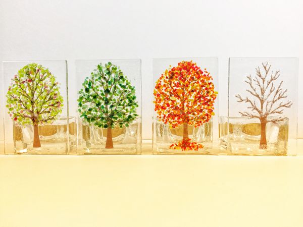 fused glass tealight holder in four seasons tree designs - Spring, Sumer, Autumn, Winter.