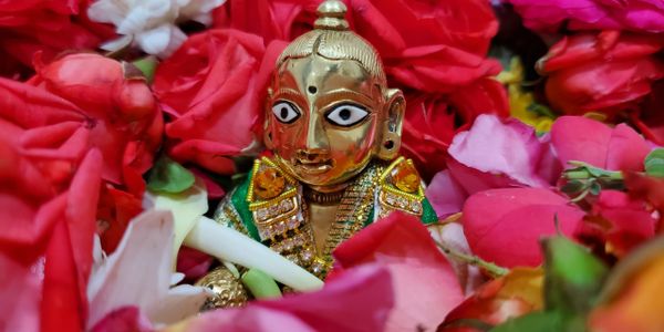 Baby Krishna idol with Flowers