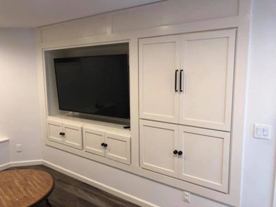 A Finished Basement with a built in Entertainment Center