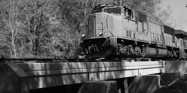 A freight train travels over the completed bridge project thautilized the Conical Connection System
