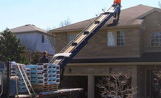Roofing material delivery Iko Cambridge roof mart
delivering roofing material to the roof