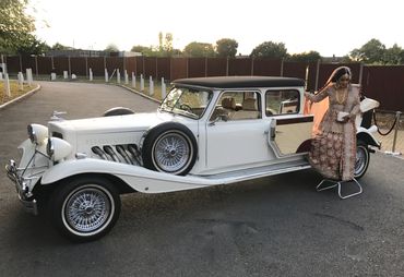 bride getting out of vintage car