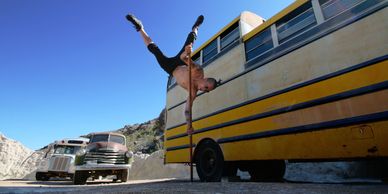 A gymnast performing a stunt outdoor
