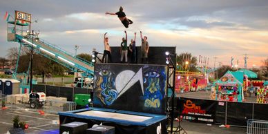 A view of competitive gymnasts on stage