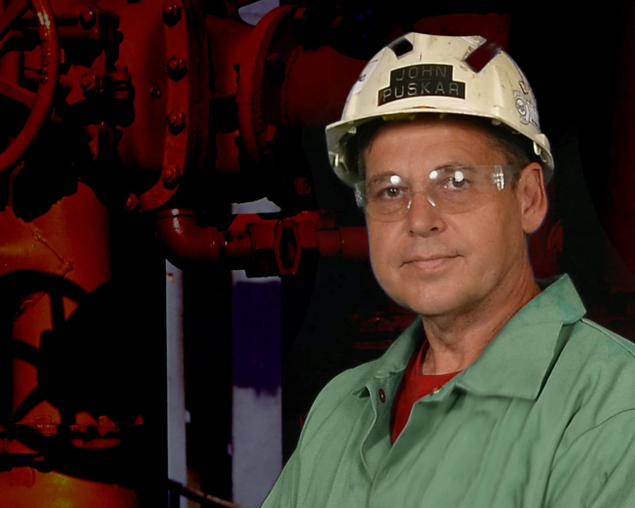 John Puskar at the industrial site with a hard hat and flame retardent clothing