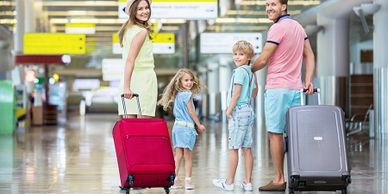 Family eagerly walking towards a gate at a South Florida airport, cruise operators