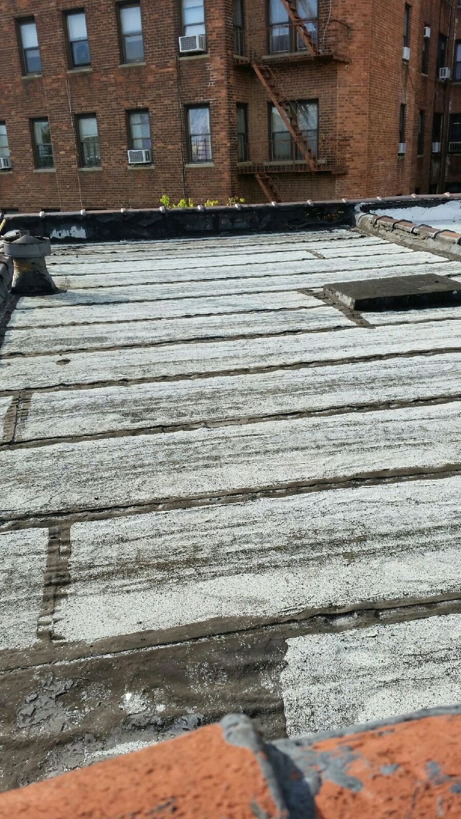 This is a before picture of a flat roof in Brooklyn NY The roofing was all removed  by our roofers.