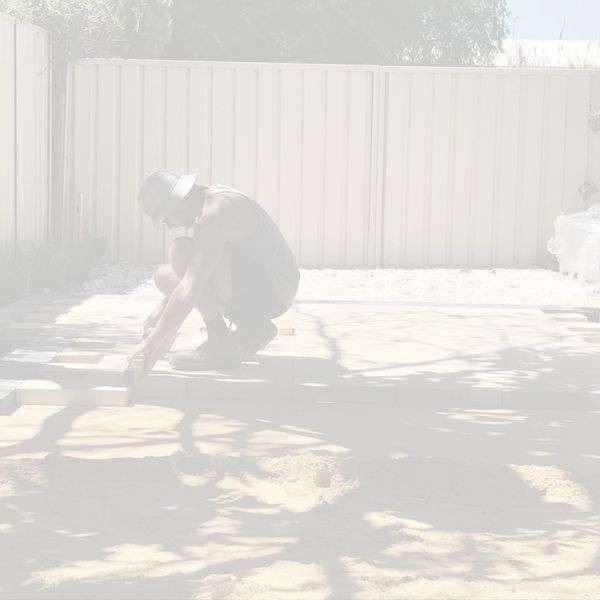 outdoors levelling paving, new pavers being laid