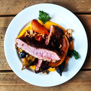 Pan fried harissa glazed duck breast, star anise carrot puree, roasted carrots and dukkah