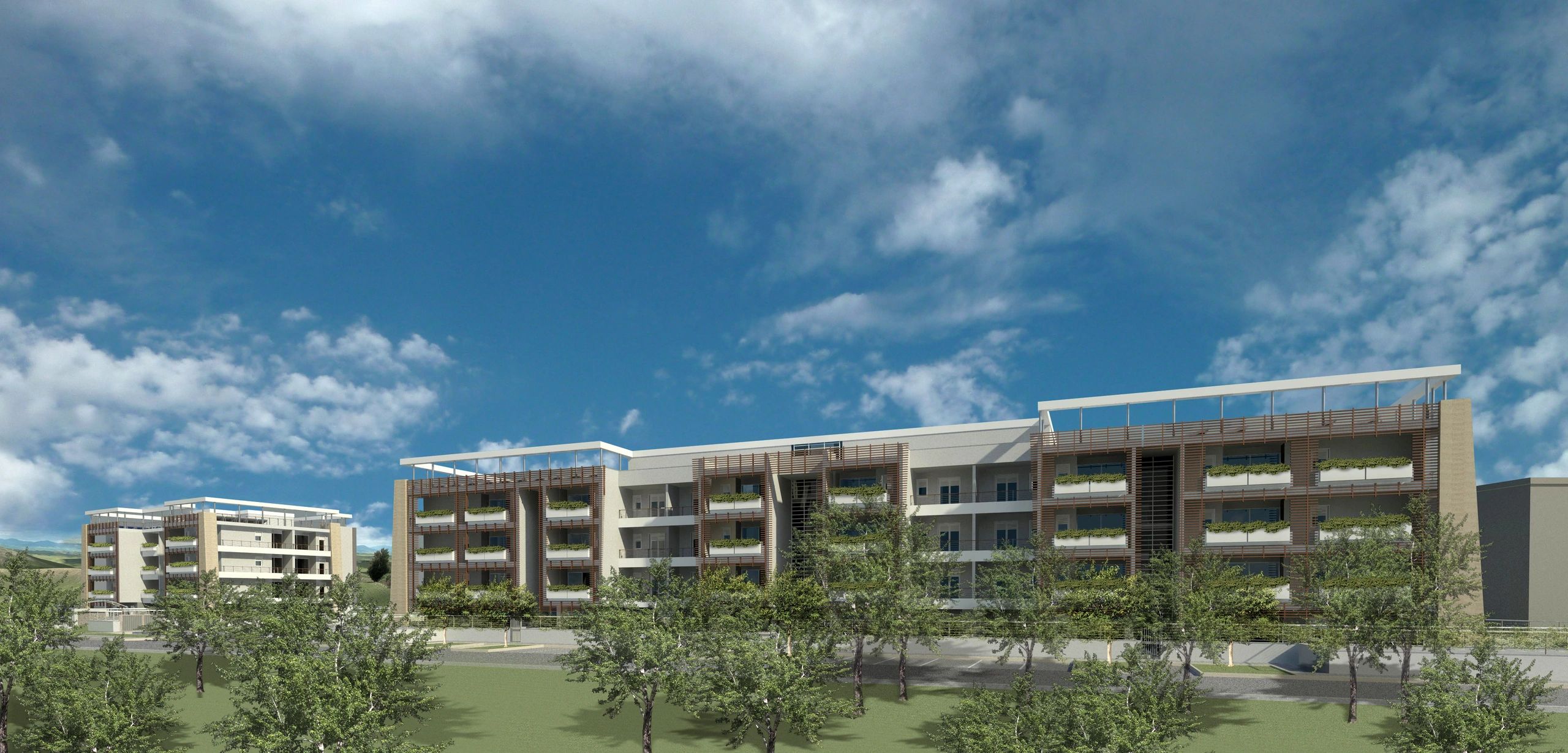 Complesso moderno con terrazze verdi, grandi balconi e struttura armoniosa nel verde.