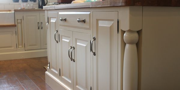 Painted Wooden Kitchen Base units custom built with metal handles on doors and Drawers