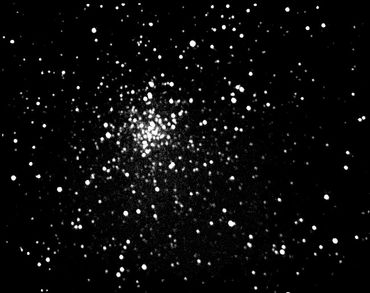 Mags 11 to 16 stars, immersed in rich Milky Way star background and nebula, 29 light-years diameter