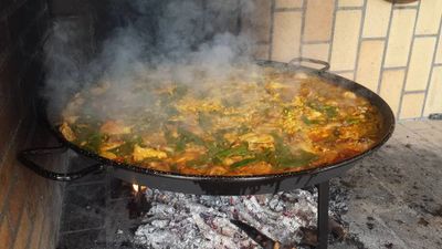 Authentic Paella Valenciana cooked over orange wood. This authentic recipe has been approved