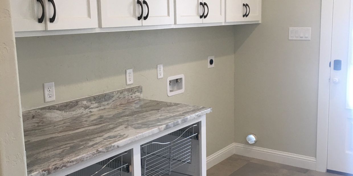 laundry cabinetry installation with wire racks