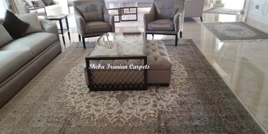 Nain handmade hand knotted wool and silk Persian carpet in sitting room
