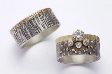 Girl Meets Joy Jewelry custom wedding bands with sterling silver, 14k gold, and white diamonds.