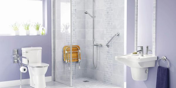 Shower remodel with wall mounted folding shower seat and safety accessories for seniors