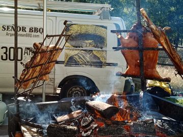 Rib cage, piglet and lamb "a la cruz". Argentinean Charcoal grill catering