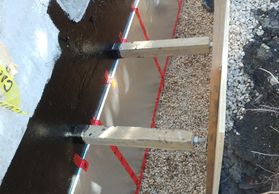 backfilled with washed rock to reduce lateral pressure