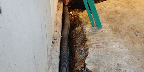 trench for interior weeping tile