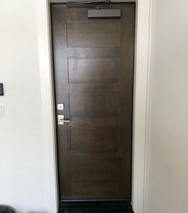 a hotel-style dark brown interior door