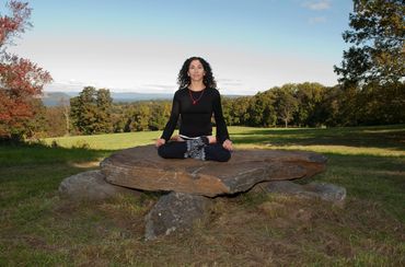 Peaceful meditation in lotus yoga pose in Rockefeller State Park, New York