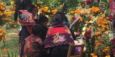 Mayan family dressed in handwoven traditional dress in a San Lorenzo Zinacantan, Chiapas, Mexico.