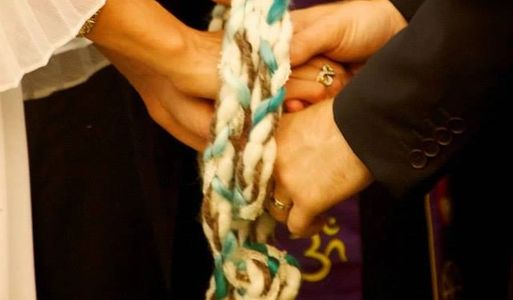 Handfasting cord by Shira Tarantino; A couple performing the rite of handfasting at their wedding